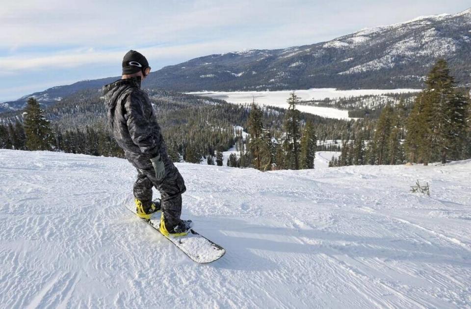 A snowboarder begins his descent down the mountain at China Peak Mountain Resort near Huntington Lake in 2015. The resort is expected to open early next month for the 2016-17 snow-play season.