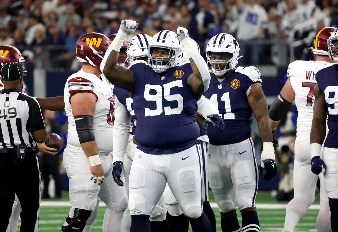 Dallas Cowboys defensive tackle Johnathon Hankins celebrates sacking Washington Commanders quarterback Sam Howell on Thursday, November 23, 2023, at AT&T Stadium in Arlington.