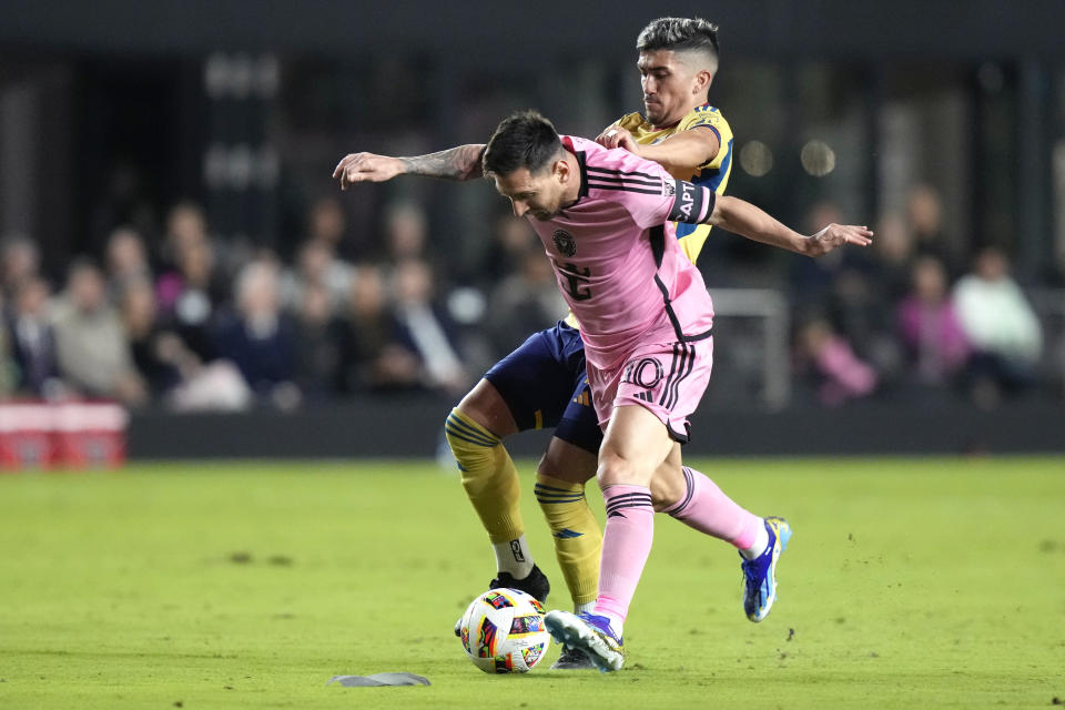 Inter Miami forward Lionel Messi, front, controls the ball as Real Salt Lake midfielder Pablo Ruiz defends during the first half of an MLS soccer match Wednesday, Feb. 21, 2024, in Fort Lauderdale, Fla. (AP Photo/Lynne Sladky)