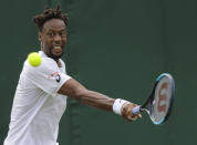 Gael Monfils of France returns to Ugo Humbert of France in a Men's singles match during day one of the Wimbledon Tennis Championships in London, Monday, July 1, 2019. (AP Photo/Ben Curtis)