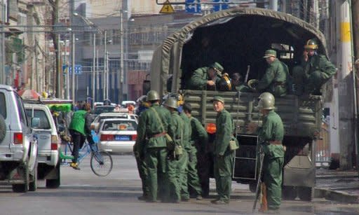 File photo of Chinese soldiers in the Tibetan capital Lhasa. Hundreds of people have been detained in Lhasa after two men set themselves on fire in the Tibetan regional capital on Sunday in protest against Chinese rule, a US-based broadcaster reported