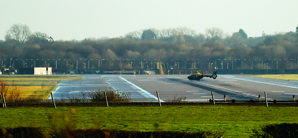 <em>A helicopter sits on the runway at Gatwick this morning (PA)</em>