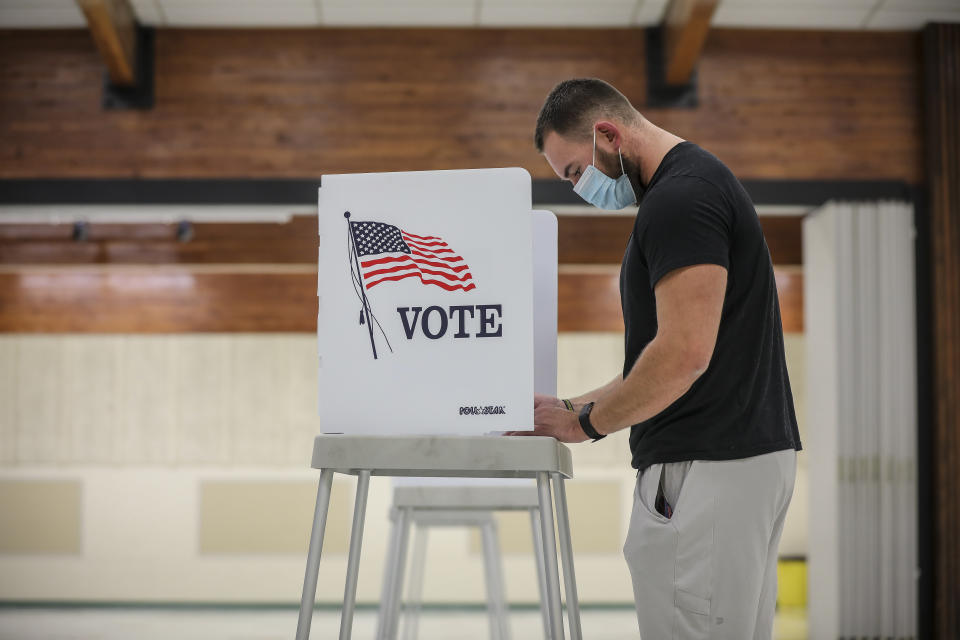 GOLDEN, CO - NOVEMBER 03: First time voter Daylon Stutz, 23, votes at the Jefferson County Fairgrounds on November 3, 2020 in Golden, Colorado. After a record-breaking early voting turnout, Americans head to the polls on the last day to cast their vote for incumbent U.S. President Donald Trump or Democratic nominee Joe Biden in the 2020 presidential election. (Photo by Marc Piscotty/Getty Images)