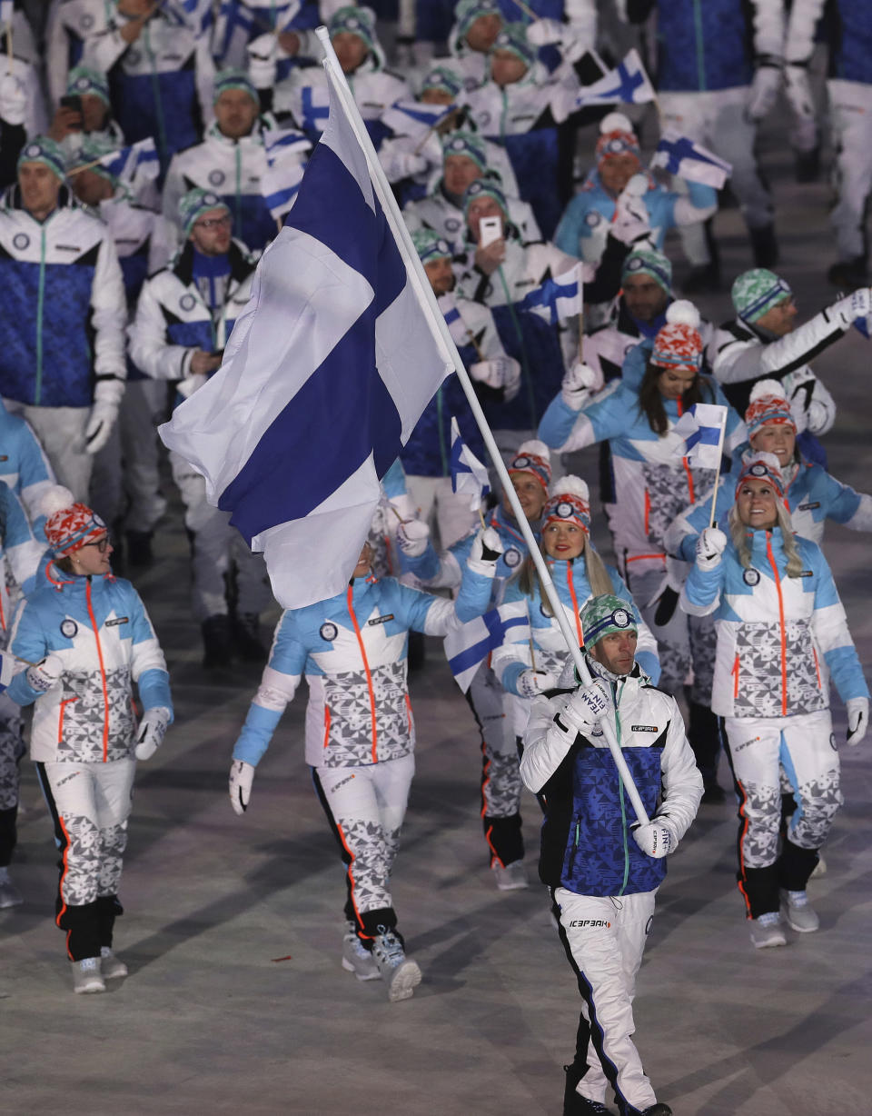<p>Janne Ahonen carries the flag of Finland during the opening ceremony of the 2018 Winter Olympics in Pyeongchang, South Korea, Friday, Feb. 9, 2018. (AP Photo/Michael Sohn) </p>