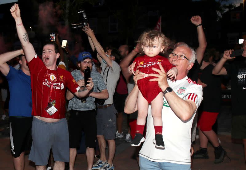 Premier League - Liverpool fans celebrate winning the Premier League