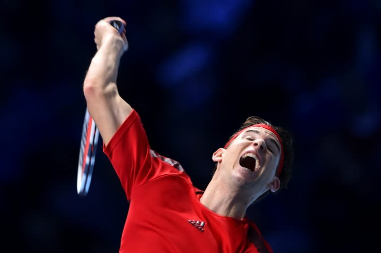 Austria's Dominic Thiem serves against Bulgaria's Grigor Dimitrov during the ATP World Tour Finals tennis tournament in London on November 13, 2017