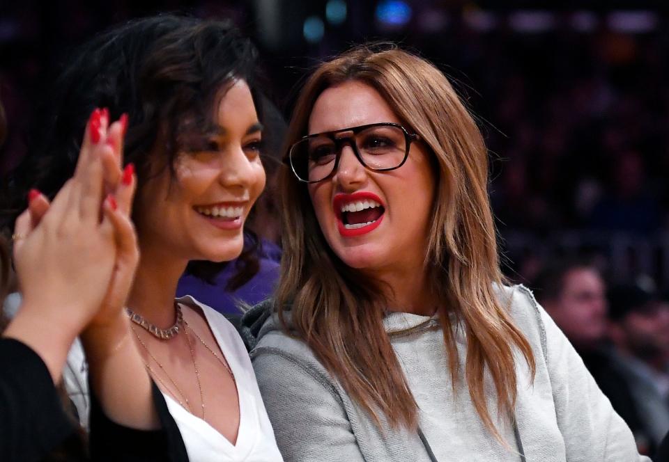 Vanessa Hudgens, left, and Ashley Tisdale watch during the second half of an NBA basketball game between the Los Angeles Lakers and the Detroit Pistons, Jan. 15, 2017, in Los Angeles. 