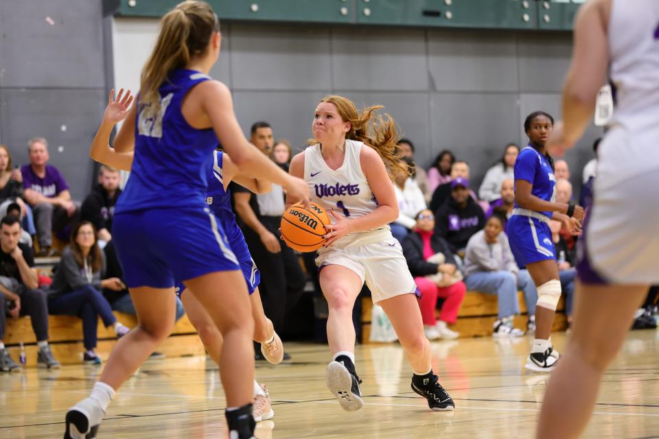 New York University's Chloe Teter of Little Silver, N.J., takes strides towards the basket at a recent game.