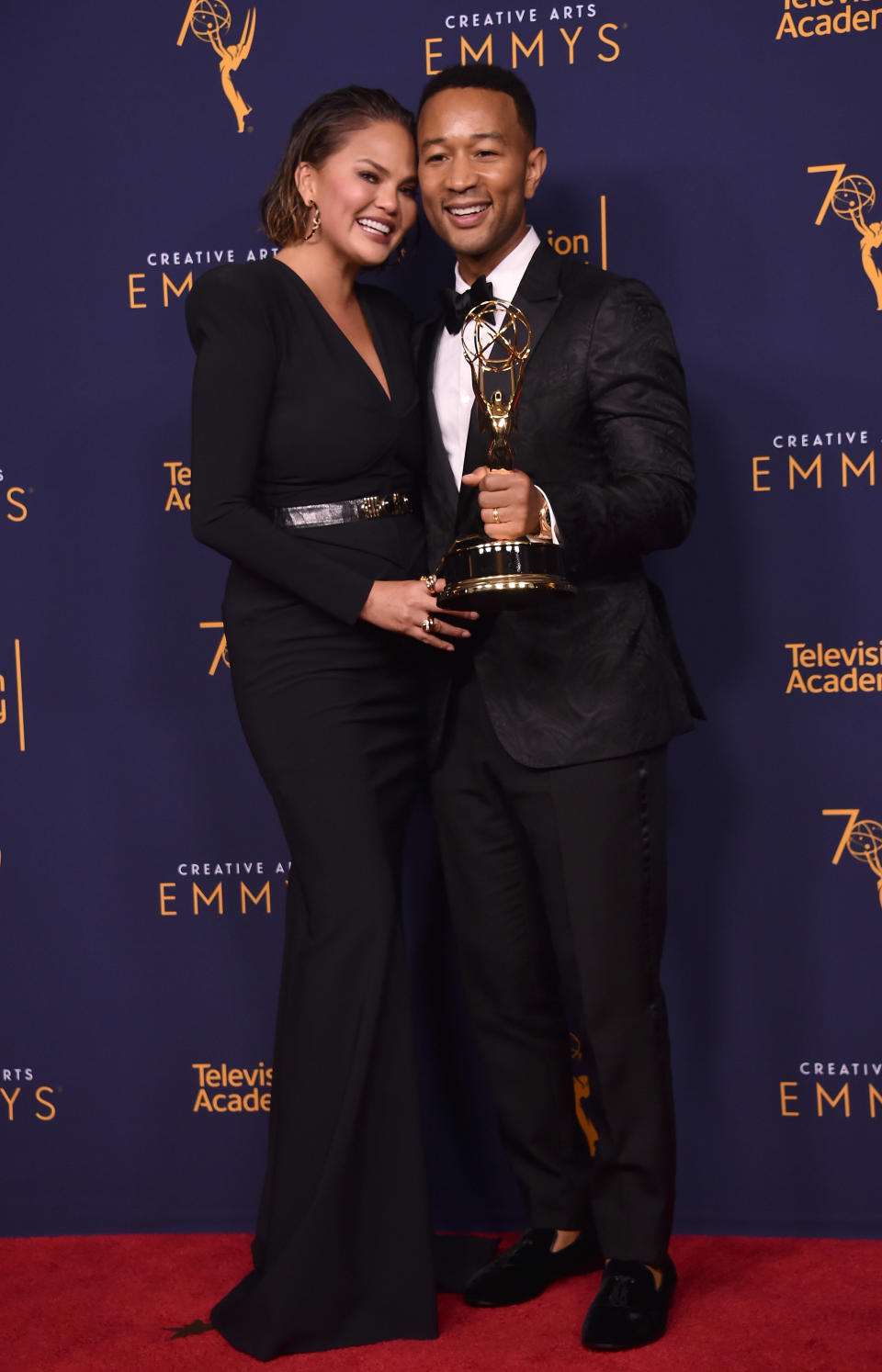 Chrissy Teigen and John Legend are one of the entertainment industry's most beloved couples. At the 2018 Emmys (as seen in this photo), they upped the cute factor with their coordinated ensembles, which perfectly complemented Legend's golden statue.