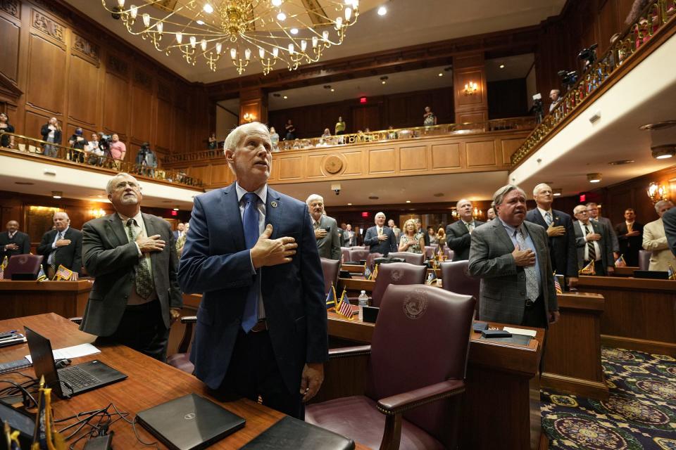 Members of the Indiana House of Representatives stand for the Pledge of Allegiance before a vote is held on Senate Bills 1 and 2 during special session Friday, August 5, 2022, at the Indiana Statehouse in Indianapolis. 