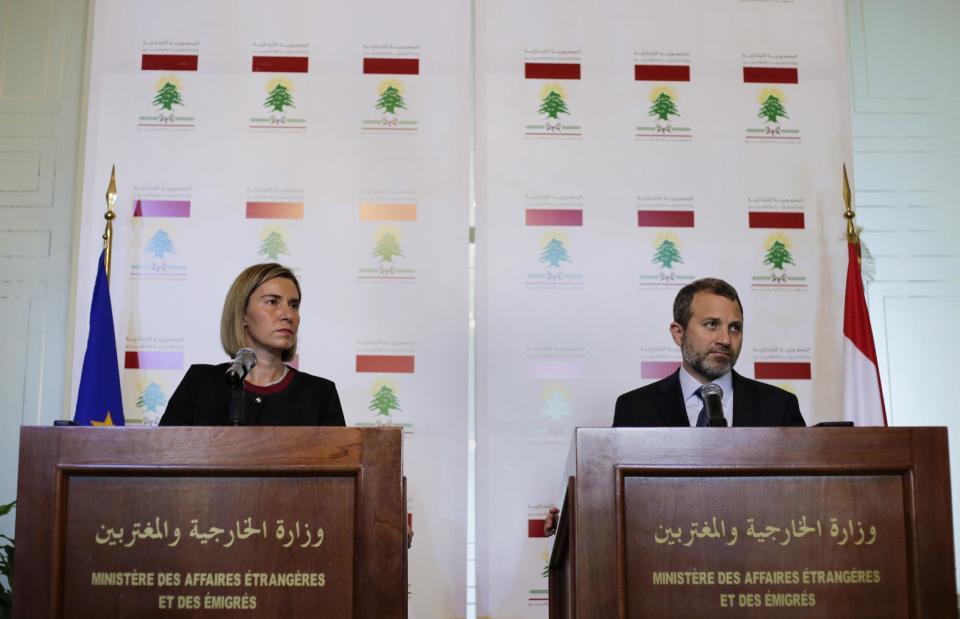 Lebanese Foreign Minister Gibran Bassil, right, and EU High Representative for Foreign Affairs Federica Mogherini, listen to a question during a joint press conference at the Lebanese Foreign Ministry in Beirut, Lebanon, Thursday, Jan. 26, 2017. Mogherini said Thursday that it is too early to comment on reports of U.S. plans for safe zones in Syria and that the European Union "will consider plans when they come." (AP Photo/Hassan Ammar)