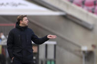 Bremen's head coach Florian Kohfeldt gestures during the German Bundesliga soccer match between 1. FC Cologne and Werder Bremen in Cologne, Germany, Sunday, March 7, 2021. (Rolf Vennenbernd/dpa via AP)