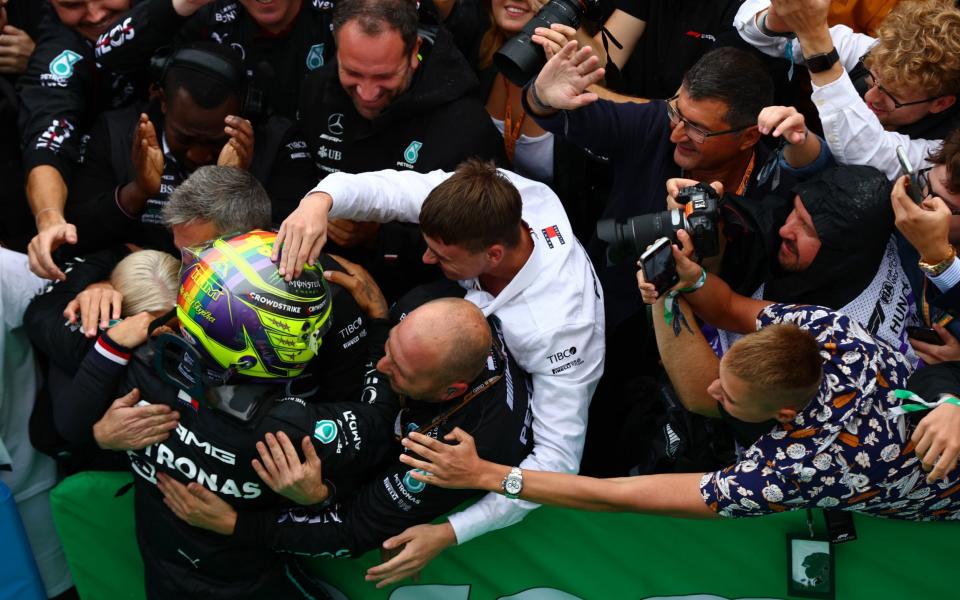 Second-place Lewis Hamilton is congratulated by his Mercedes team - GETTY IMAGES