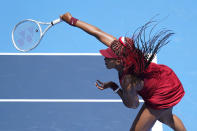 Naomi Osaka, of Japan, serves to China's Zheng Saisai during the tennis competition at the 2020 Summer Olympics, Sunday, July 25, 2021, in Tokyo, Japan. (AP Photo/Patrick Semansky)