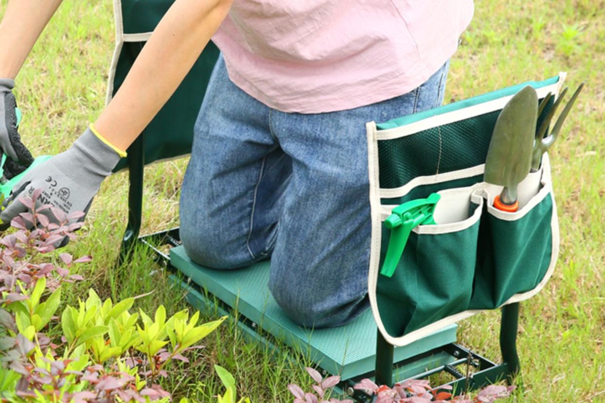 someone using the gardening bench from Amazon 