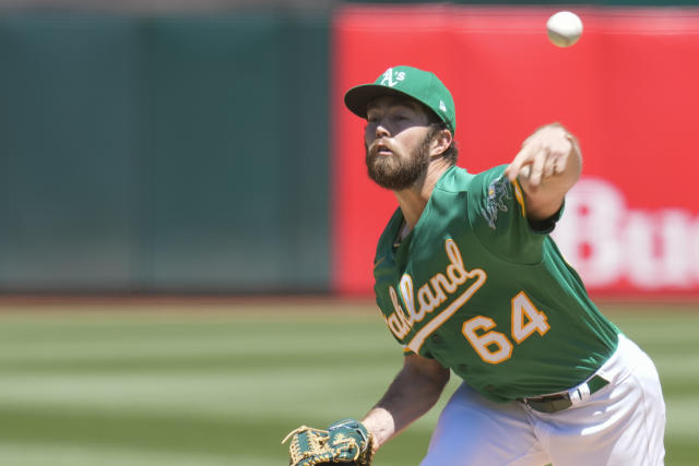Oakland Athletics' Ken Waldichuk pitches against the Cincinnati Reds during the first inning of a baseball game in Oakland, Calif., Sunday, April 30, 2023. (AP Photo/Godofredo A. Vásquez)