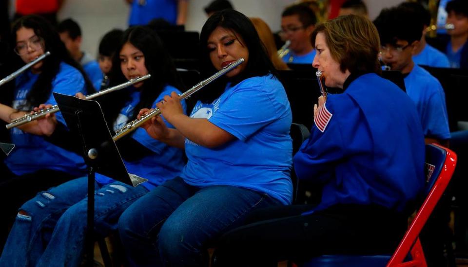 Ellen Ochoa, veteran astronaut and former director of NASA’s Johnson Space Center, plays her flute with band students while they perform the school’s fight song at Pasco middle school that is her namesake during a morning assembly. During her fifth visit to the school since the school opened in 2002, orchestra students performed “Reach for the Stars.”
