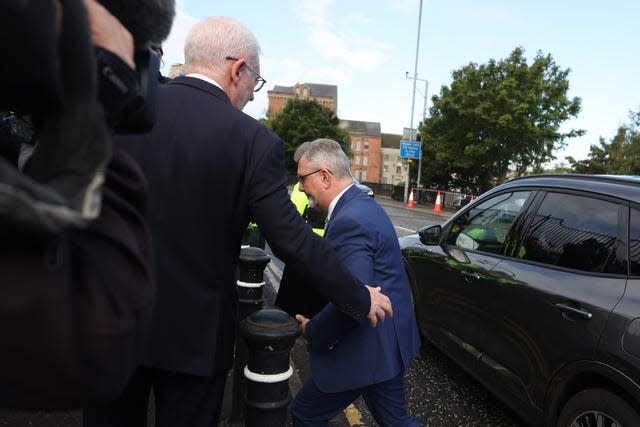 Sir Jeffrey Donaldson exiting a car