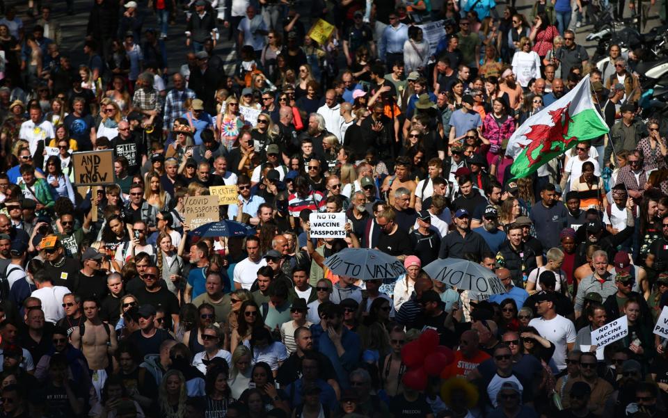 Protesters march during a "Unite For Freedom" anti-lockdown demonstration - Hollie Adams/Getty Images