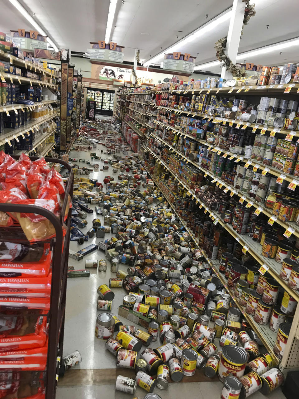 This photo provided by Adam Graehl shows food that fell from shelves on the floor at the Stater Bros. on China Lake Blvd., in Ridgecrest, Calif., Thursday, July 4, 2019. The strongest earthquake in 20 years shook a large swath of Southern California and parts of Nevada on Thursday, rattling nerves on the July 4th holiday and causing injuries and damage in a town near the epicenter, followed by a swarm of ongoing aftershocks. (Adam Graehl via AP)