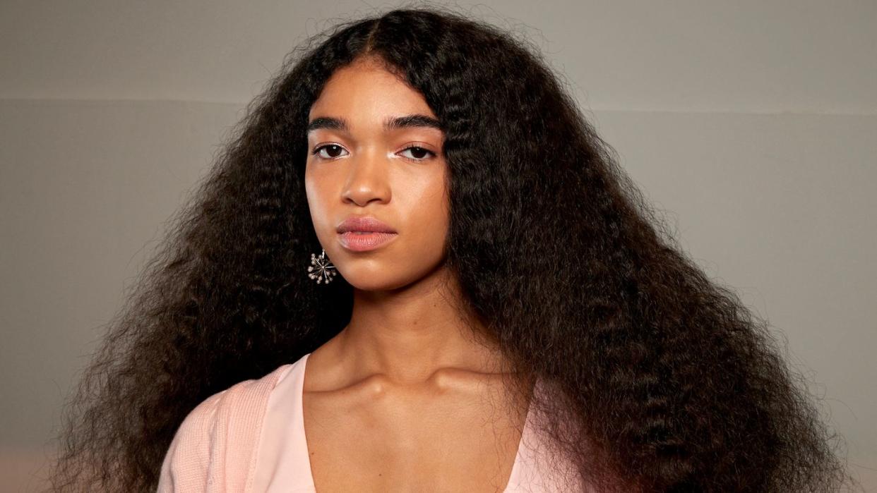 woman with long curly hair