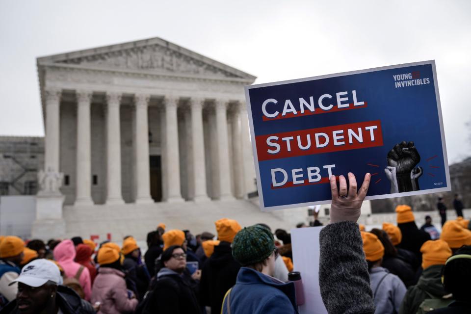 People rally in support of the Biden administration's student debt relief plan in front of the the Supreme Court on February 28, 2023, in Washington, D.C.