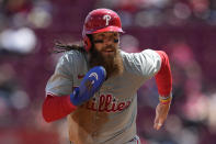 Philadelphia Phillies' Brandon Marsh runs from second to score on a single hit by Bryson Stott sixth inning of a baseball game against the Cincinnati Reds, Thursday, April 25, 2024, in Cincinnati. The Phillies won 5-0. (AP Photo/Carolyn Kaster)