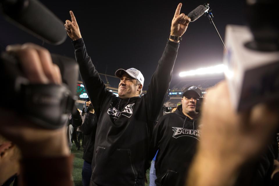 Philadelphia Eagles head coach Doug Pederson raises his hands to the fans as he heads into the tunnel after defeating the Minnesota Vikings in the NFC Championship 38-7 on Jan. 21, 2018.