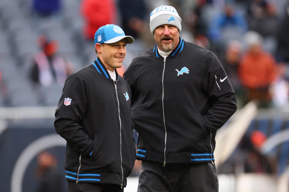 Head coach Dan Campbell of the Detroit Lions speaks with offensive coordinator Ben Johnson prior to the game against the Chicago Bears at Soldier Field on December 10, 2023 in Chicago, Illinois.
