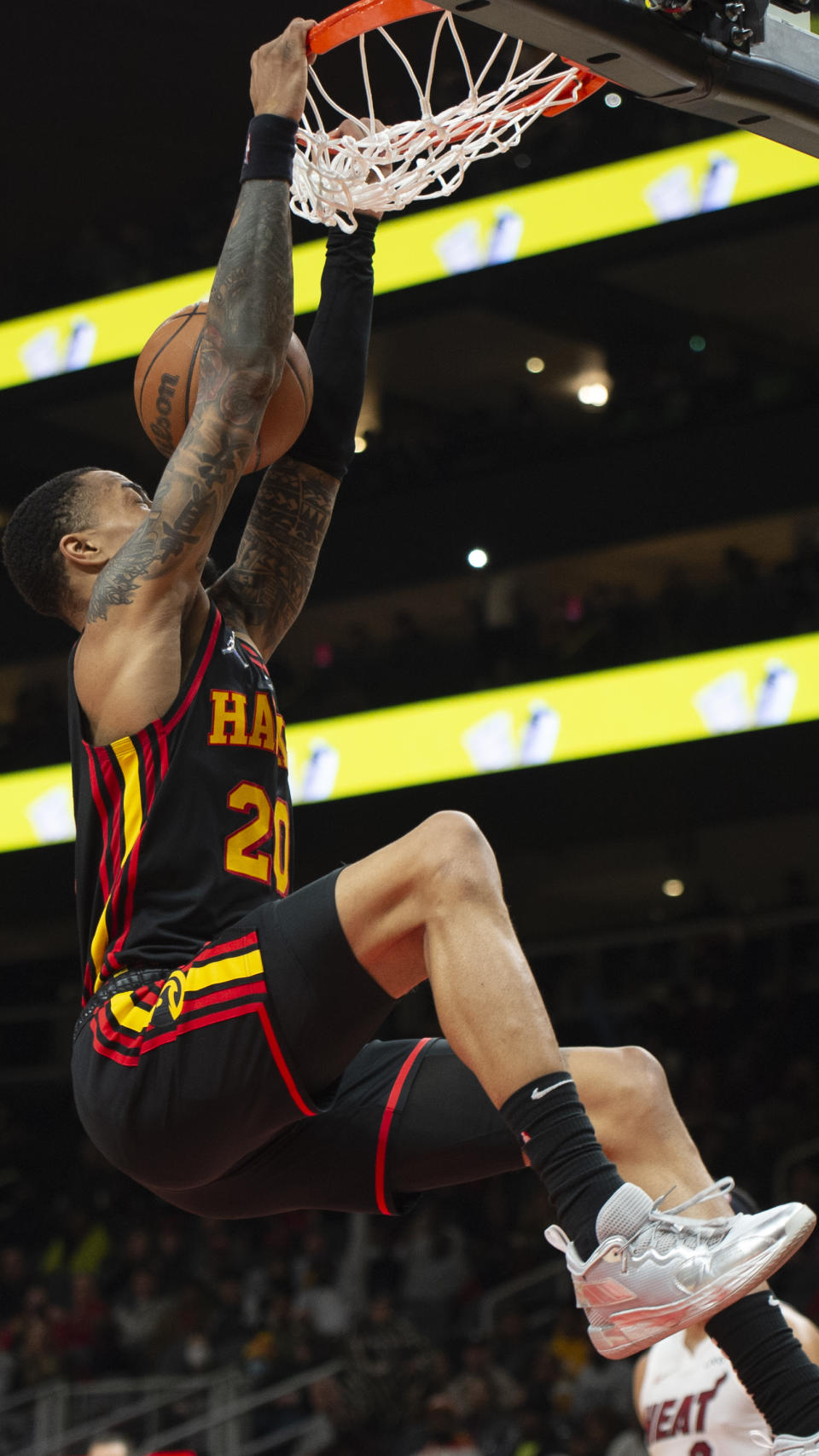 Atlanta Hawks forward John Collins (20) dunks during the first half of an NBA basketball game against the Miami Heat, Friday, Jan. 21, 2022, in Atlanta. (AP Photo/Hakim Wright Sr.)