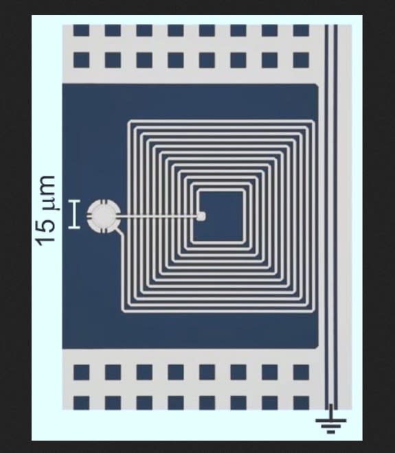 Researchers have demonstrated that a micro-drum (shown here in a colorized image with a circuit) might be used as a memory device in future quantum computers.