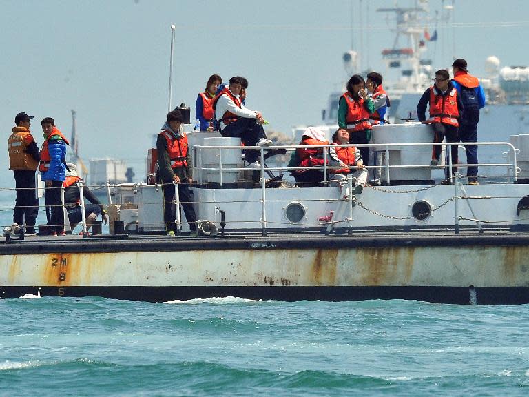 Relatives of missing passengers visit the site of the sunken South Korean ferry 'Sewol' at sea off Jindo on April 24, 2014