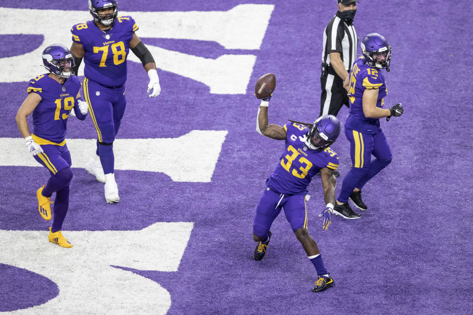 Minnesota Vikings running back Dalvin Cook (33) spikes the football after scoring on a 2-yard run against the Dallas Cowboys during an NFL football game in Minneapolis, Sunday, Nov. 22, 2020. (Jerry Holt/Star Tribune via AP)