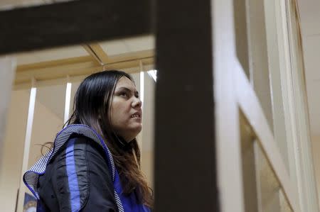 Gulchekhra Bobokulova, a nanny suspected of murdering a child in her care, looks on inside a defendants' cage as she attends a court hearing in Moscow, Russia, March 2, 2016. REUTERS/Maxim Shemetov