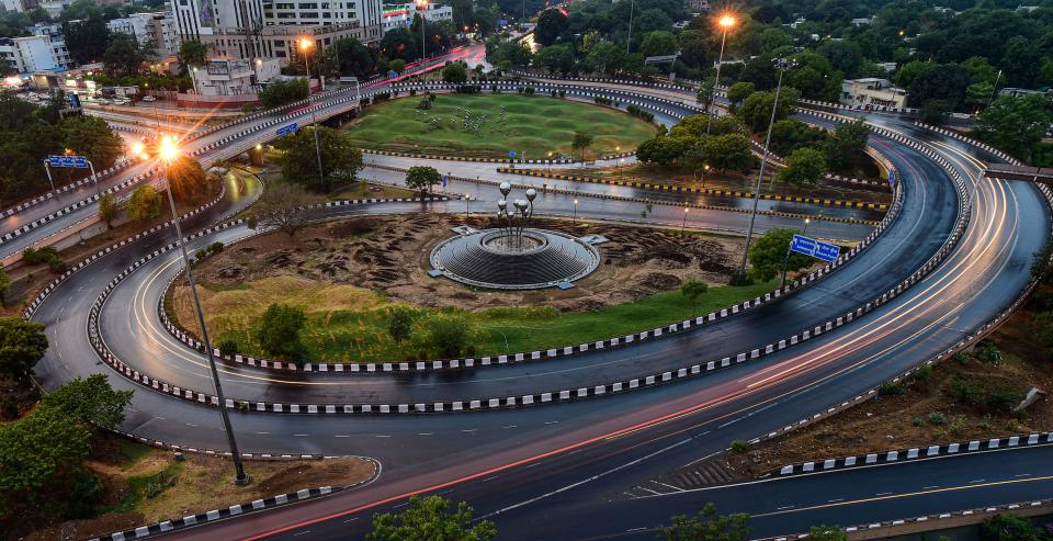 A long-exposure photograph shows light trails due to passing of vehicles at the AIIMS flyover during COVID-induced lockdown in New Delhi on Thursday.