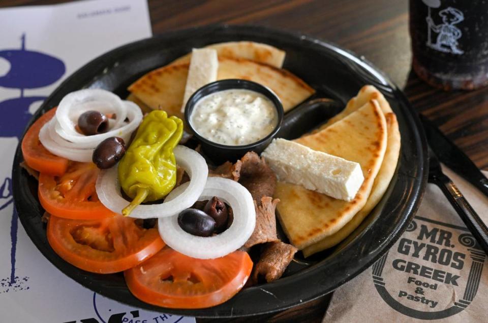 The Gyro Platter at Mr. Gyro’s comes with a big pile of meat, pita bread to stuff it in, tomatoes, onions, feta cheese, olives, a hot pepper and tzatziki sauce.