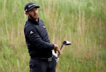 May 14, 2019; Farmingdale, NY, USA; Dustin Johnson looks over the third green during a practice round for the PGA Championship golf tournament at Bethpage State Park - Black Course. Mandatory Credit: Peter Casey-USA TODAY Sports