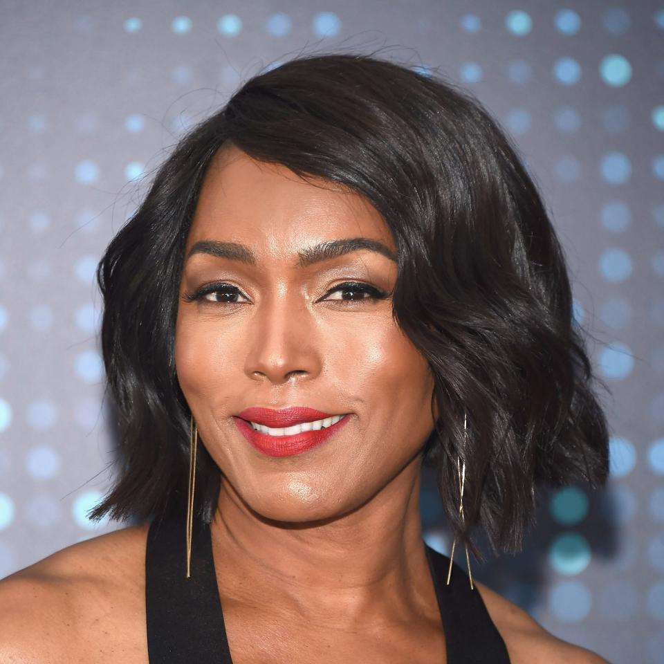 Angela Bassett smiling and she has a layered bob haircut