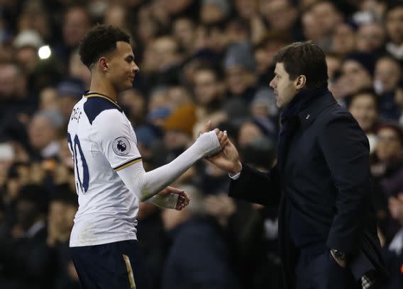 Britain Football Soccer - Tottenham Hotspur v Chelsea - Premier League - White Hart Lane - 4/1/17 Tottenham's Dele Alli with manager Mauricio Pochettino as he is substituted Action Images via Reuters / Andrew Couldridge Livepic EDITORIAL USE ONLY. No use with unauthorized audio, video, data, fixture lists, club/league logos or 