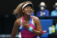 Naomi Osaka of Japan reacts during her first round match against Camila Osorio of Colombia at the Australian Open tennis championships in Melbourne, Australia, Monday, Jan. 17, 2022. (AP Photo/Hamish Blair)