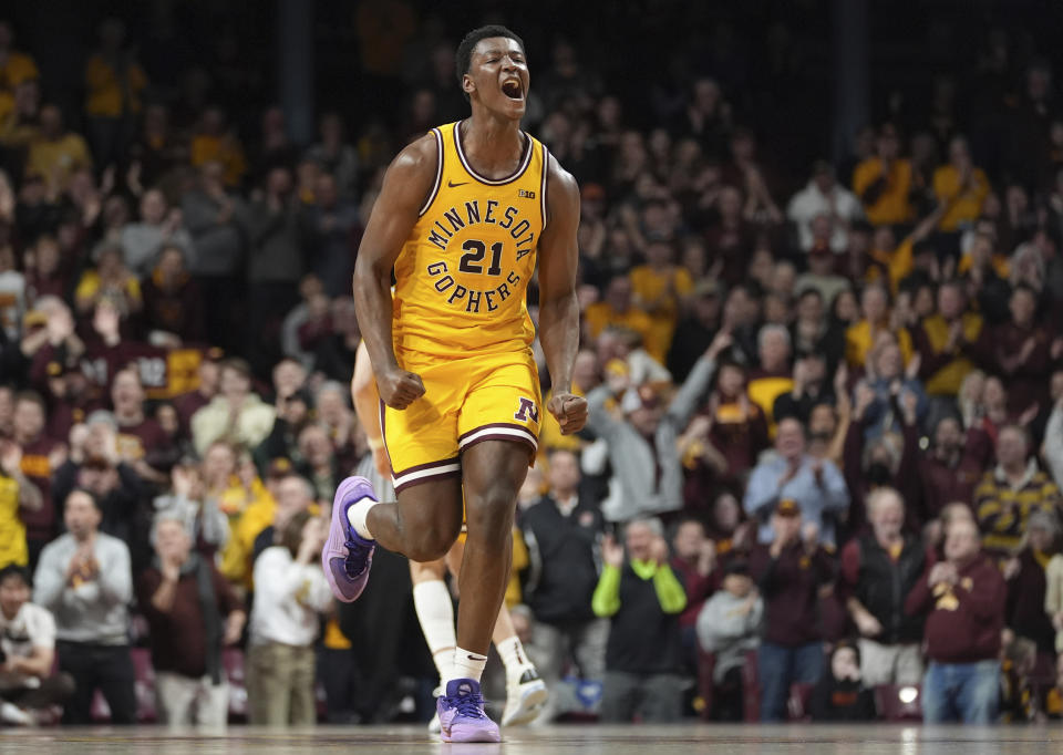 Minnesota forward Pharrel Payne (21) celebrates after a dunk during overtime of an NCAA college basketball game against Northwestern, Saturday, Feb. 3, 2024, in Minneapolis. (AP Photo/Abbie Parr)