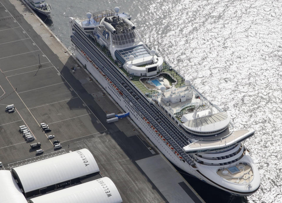 The cruise ship Diamond Princess is docked at Yokohama Port, near Tokyo, Friday, Feb. 7, 2020. Japan on Friday reported 41 new cases of a virus on the cruise ship that's been quarantined. About 3,700 people have been confined aboard the ship. (Sadayuki Goto/Kyodo News via AP)