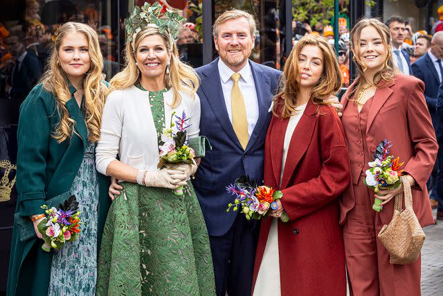 <p>Patrick van Katwijk/Getty</p> From left: Princess Catharina-Amalia, Queen Maxima, King Willem-Alexander, Princess Alexia and Princess Adriane of the Netherlands celebrate King's Day on April 27, 2024