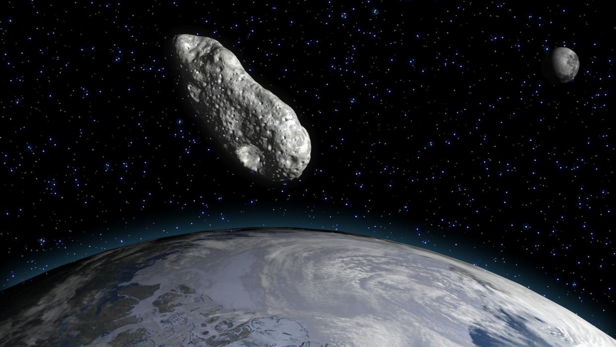  An artist's rendering of a large asteroid above the Earth. 