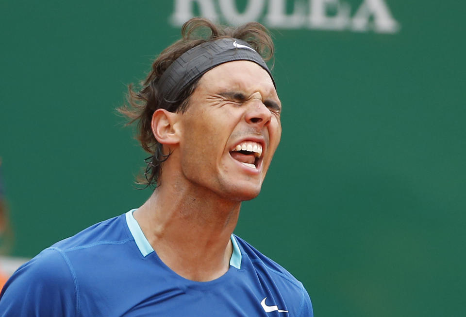 Rafael Nadal of Spain reacts after losing a point against David Ferrer of Spain during their quarterfinals match of the Monte Carlo Tennis Masters tournament in Monaco, Friday, April 18, 2014. Ferrer won 7-6 6-4. (AP Photo/Michel Euler)