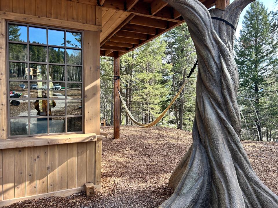 Lost Boys Treehouse hammock between faux tree trunk