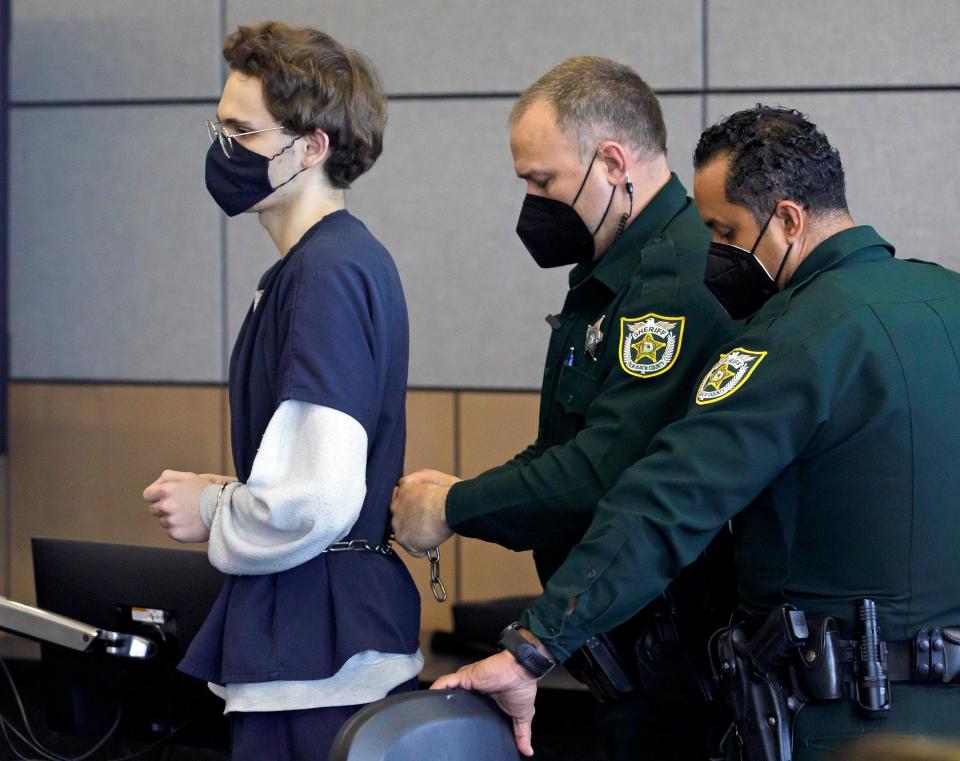 Deputies put chains on Corey Johnson after he was sentenced to life in prison Thursday, January 13, 2022 in West Palm Beach. A jury found Johnson guilty of first-degree murder in November for the 2018 fatal stabbing of his friend Jovanni Sierra during a sleepover in Palm Beach Gardens. Johnson was also found guilty of two counts of attempted murder for attacking 13-year-old Dane Bancroft and his mother, Elaine Simon.