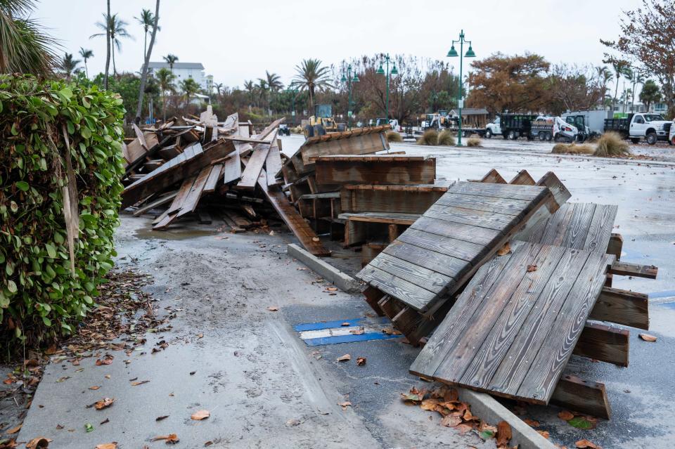 Debris is seen piled up in Lowdermilk Park in Naples, FL., on Thursday, October 13, 2022. Almost two weeks after Hurricane Ian devastated parts of Lee and Collier counties, residents in the region are still recovering from the damage caused by the category 4 hurricane.