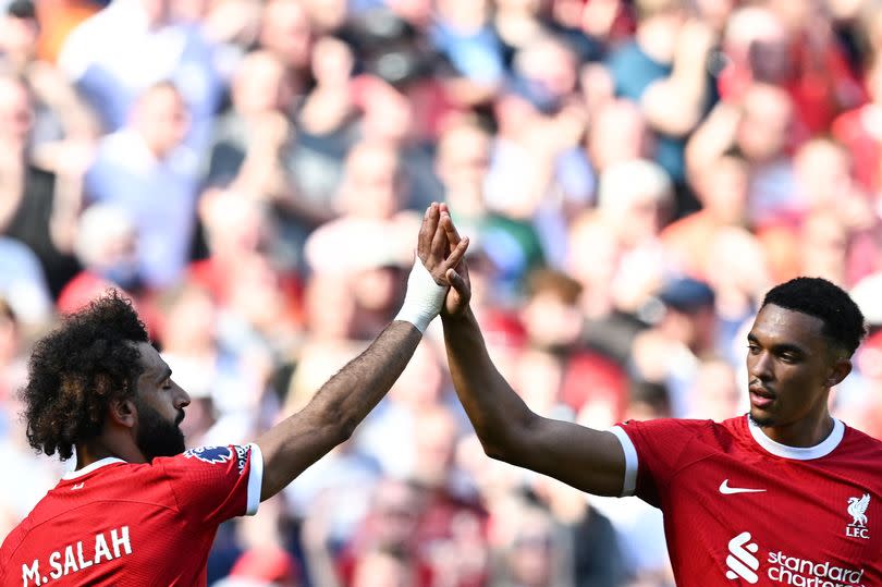 Mohamed Salah celebrates with Trent Alexander-Arnold