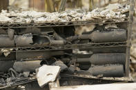 <p>The remains of burned bottles of wine are seen at the Signorello Estate Winery Tuesday, Oct. 10, 2017, in Napa, Calif. (Photo: Eric Risberg/AP) </p>